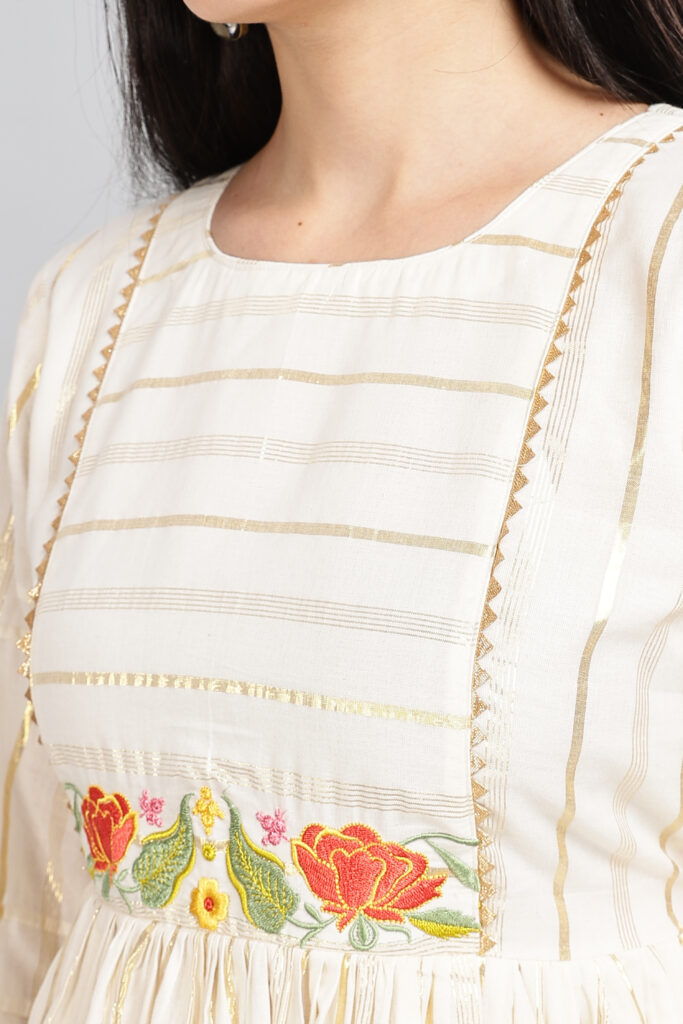 Ivory embroidered midi dress embroidery detail closeup elegant dress