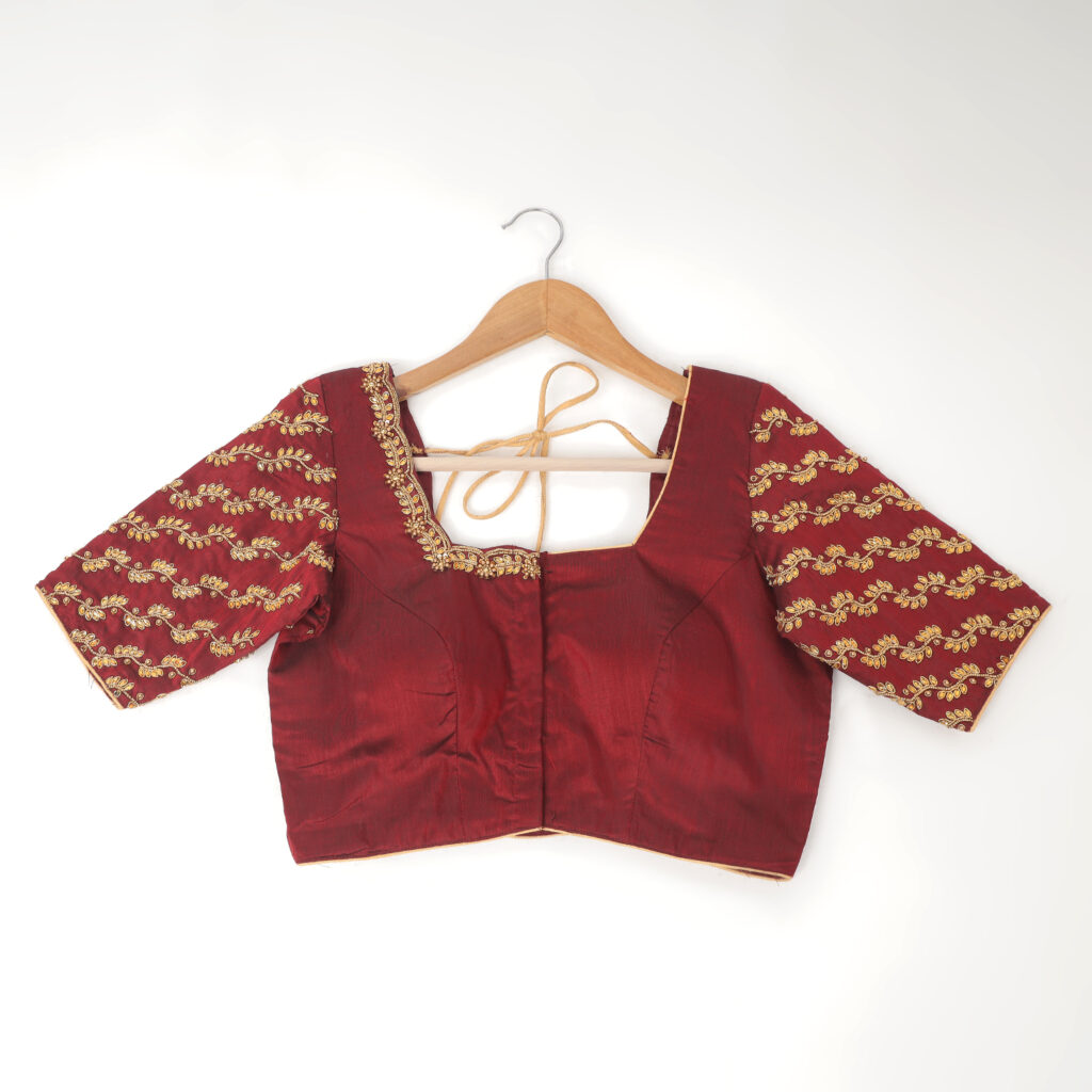 Maroon silk Aari hand embroidery detail on blouse closeup