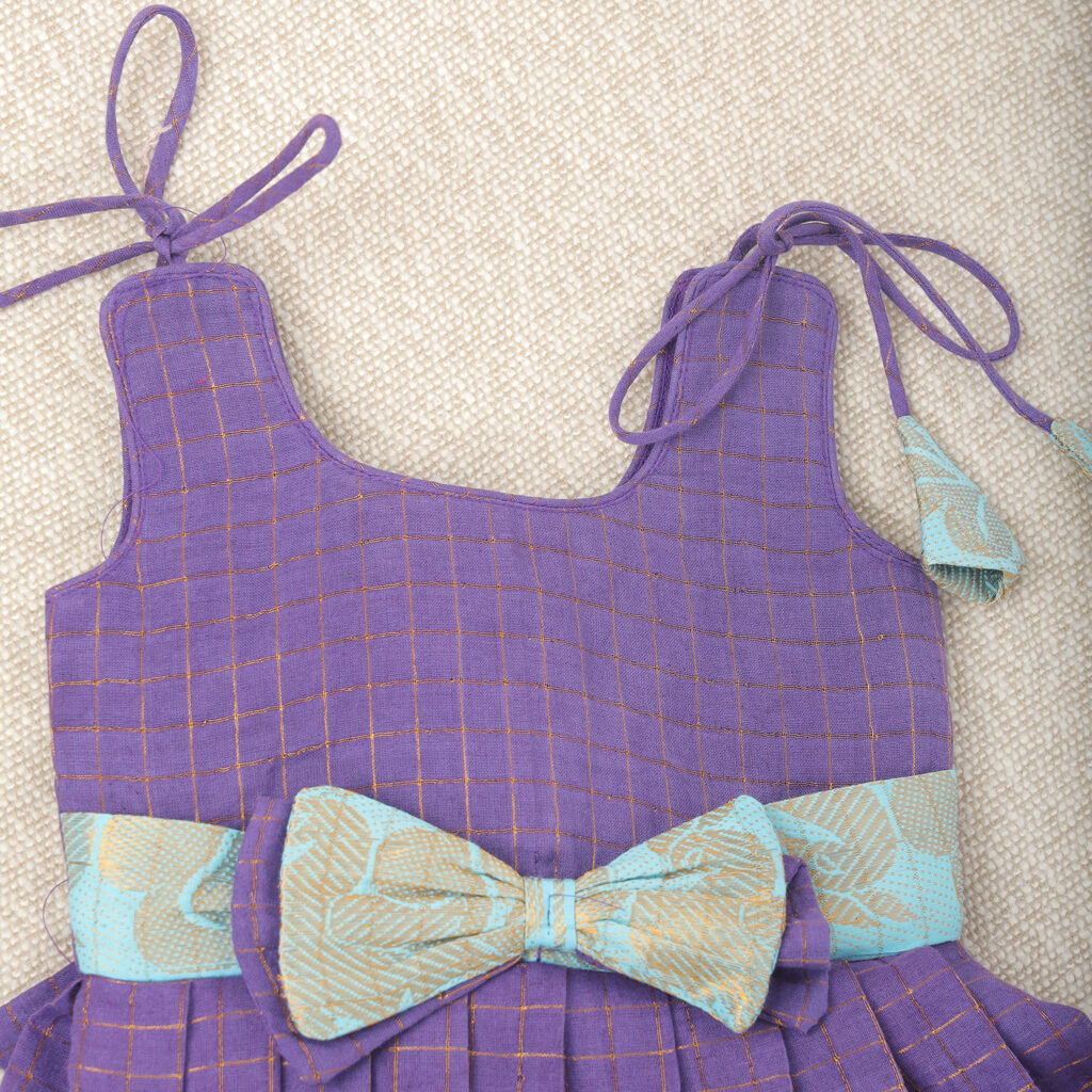 bow detail on purple and aqua kids frock