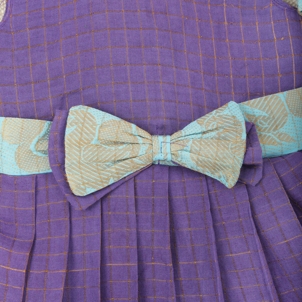 bow border detail on purple and aqua kids frock