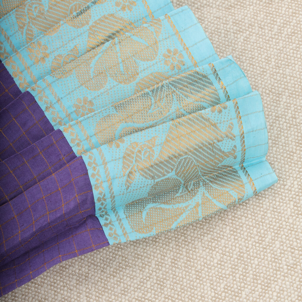 Styled flat lay of purple and aqua traditional kids frock with nigal mathi embroidery