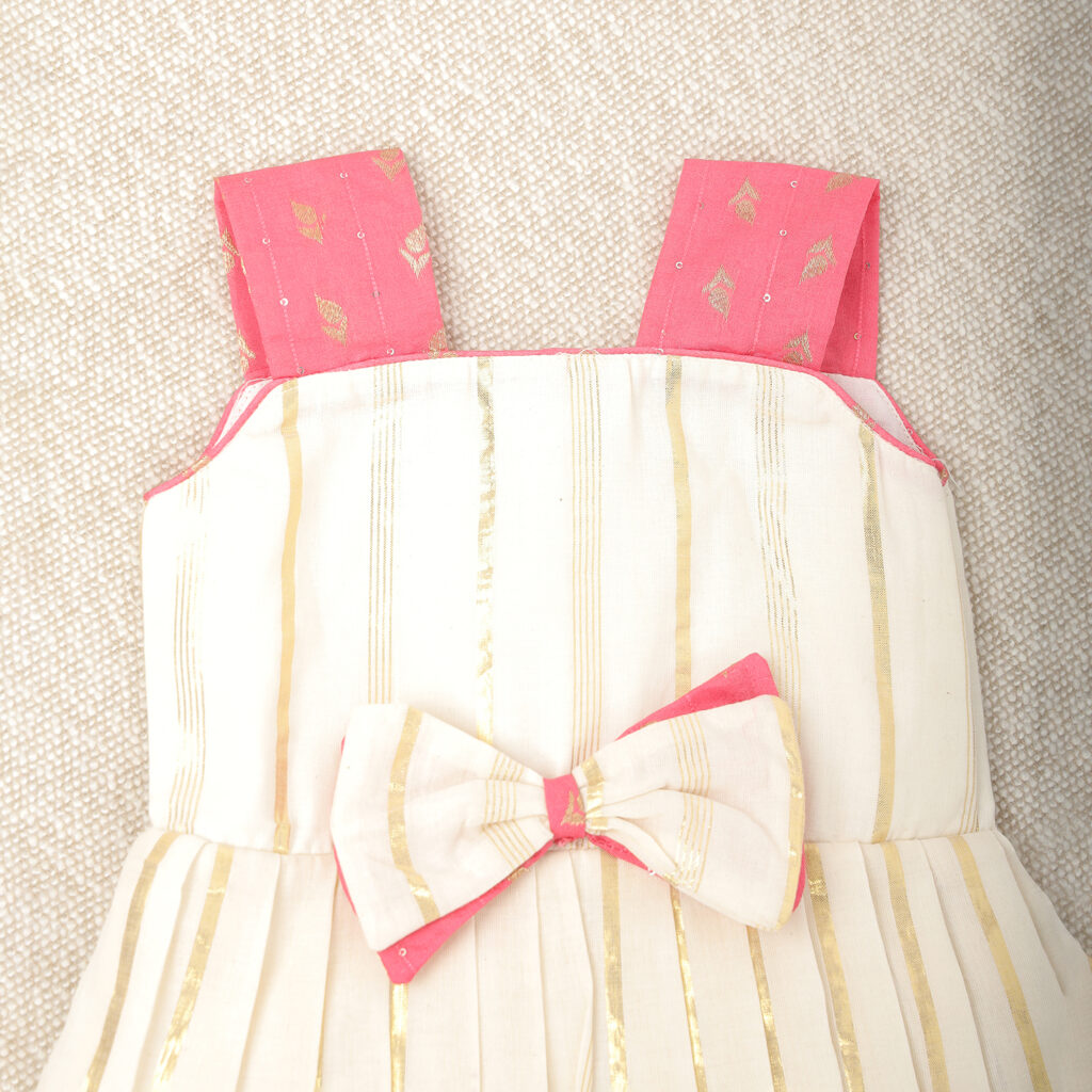 Front view of cream and pink traditional kids frock