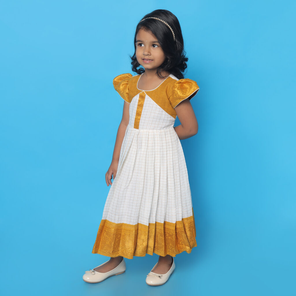 Traditional border detail of Amora mustard white kids frock
