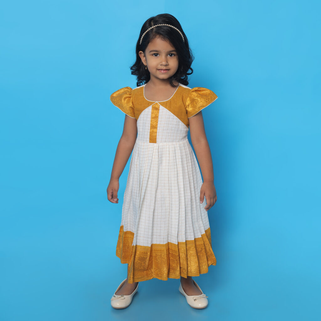 lay of Amora mustard and white patterned kids frock