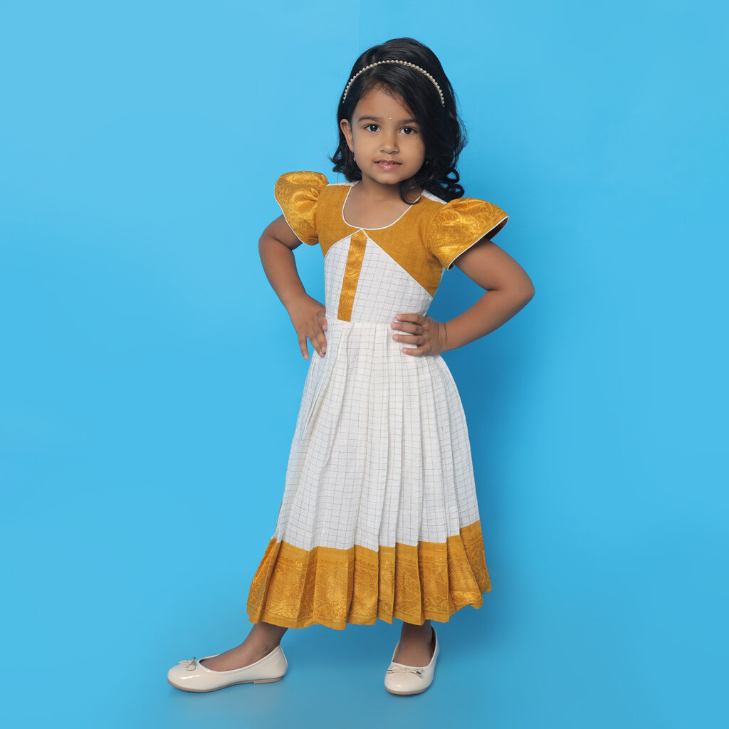 Amora mustard and white patterned kids festive frock full front view
