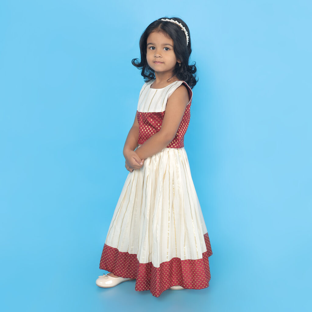Side view of Nila ivory and maroon ethnic lehenga set for girls