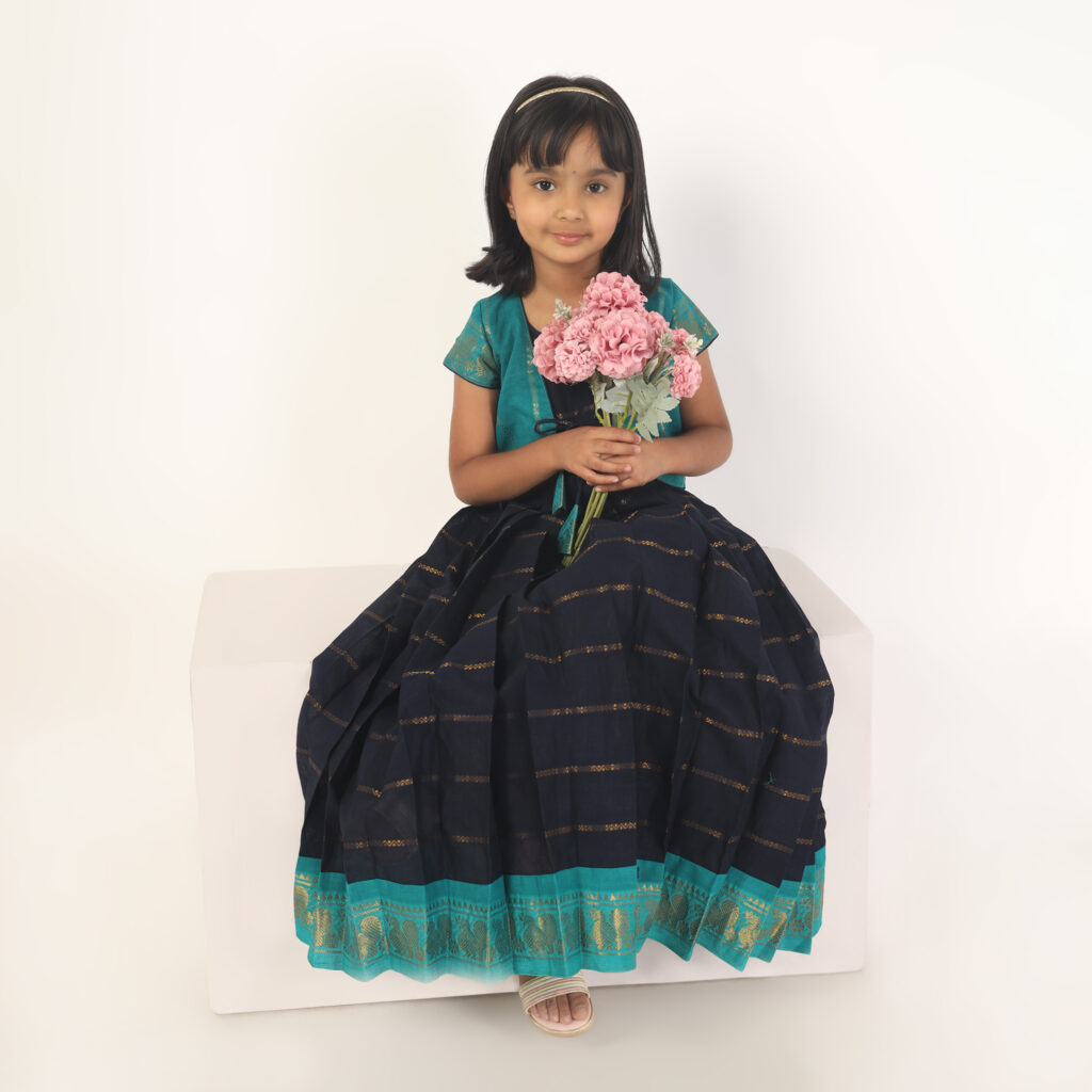 Back view of deep blue and green ethnic wear for girls