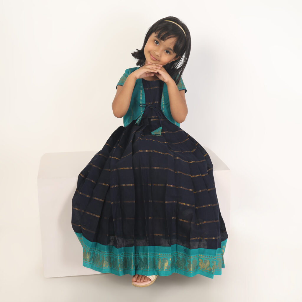 Close up detail of deep blue and green ethnic wear for girls