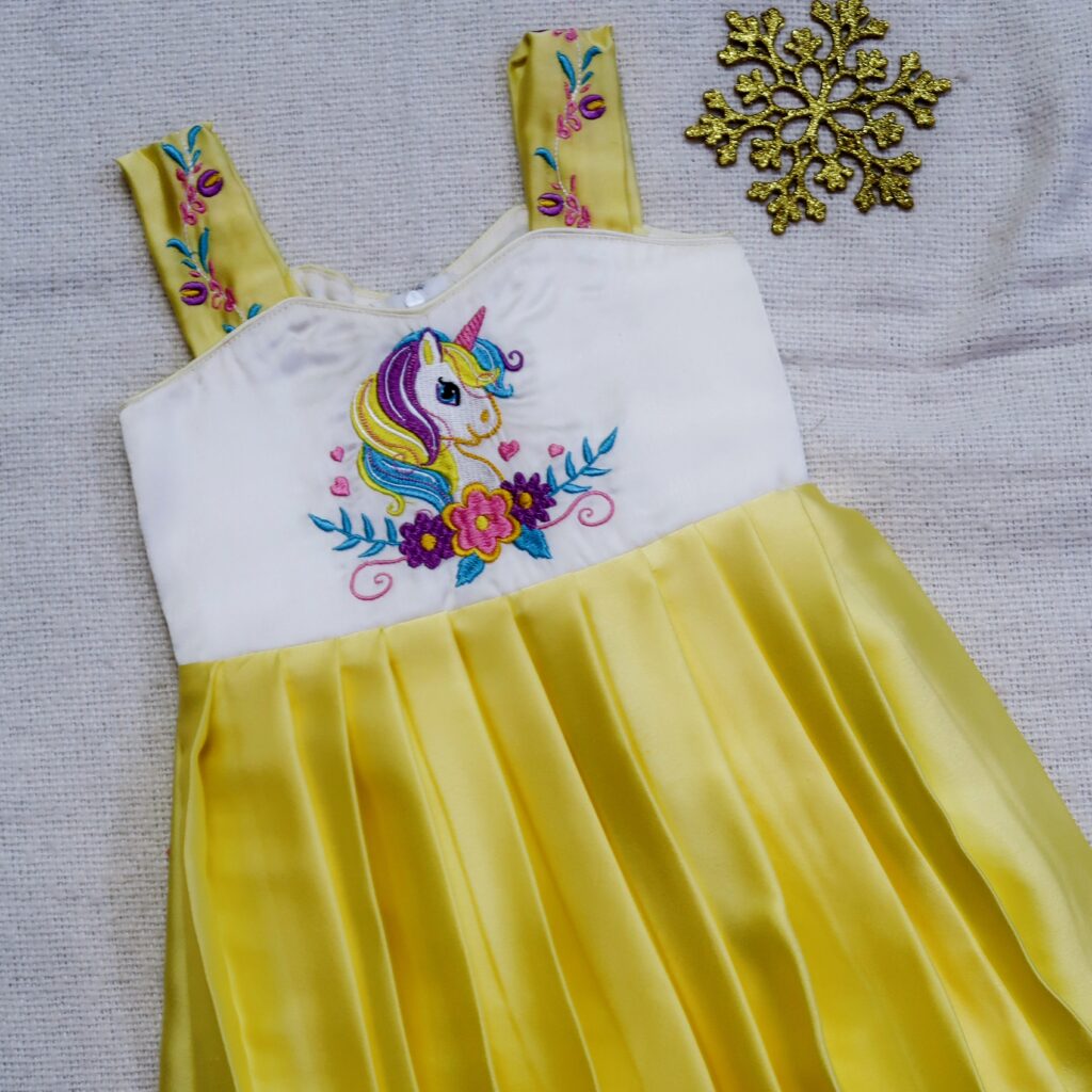 front view Nigal Mathi yellow unicorn embroidered kids frock ready stock1