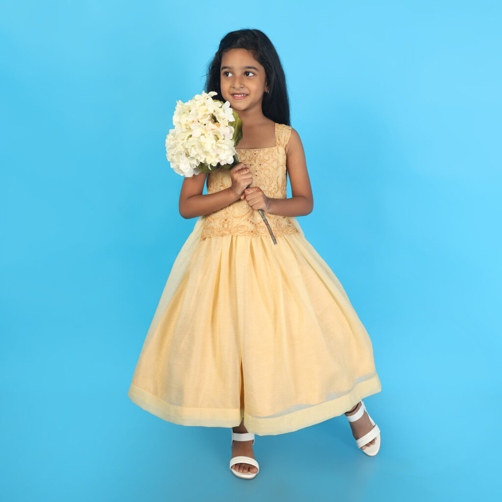 Elegant yellow embroidered kids gown front view premium party wear dress for girls