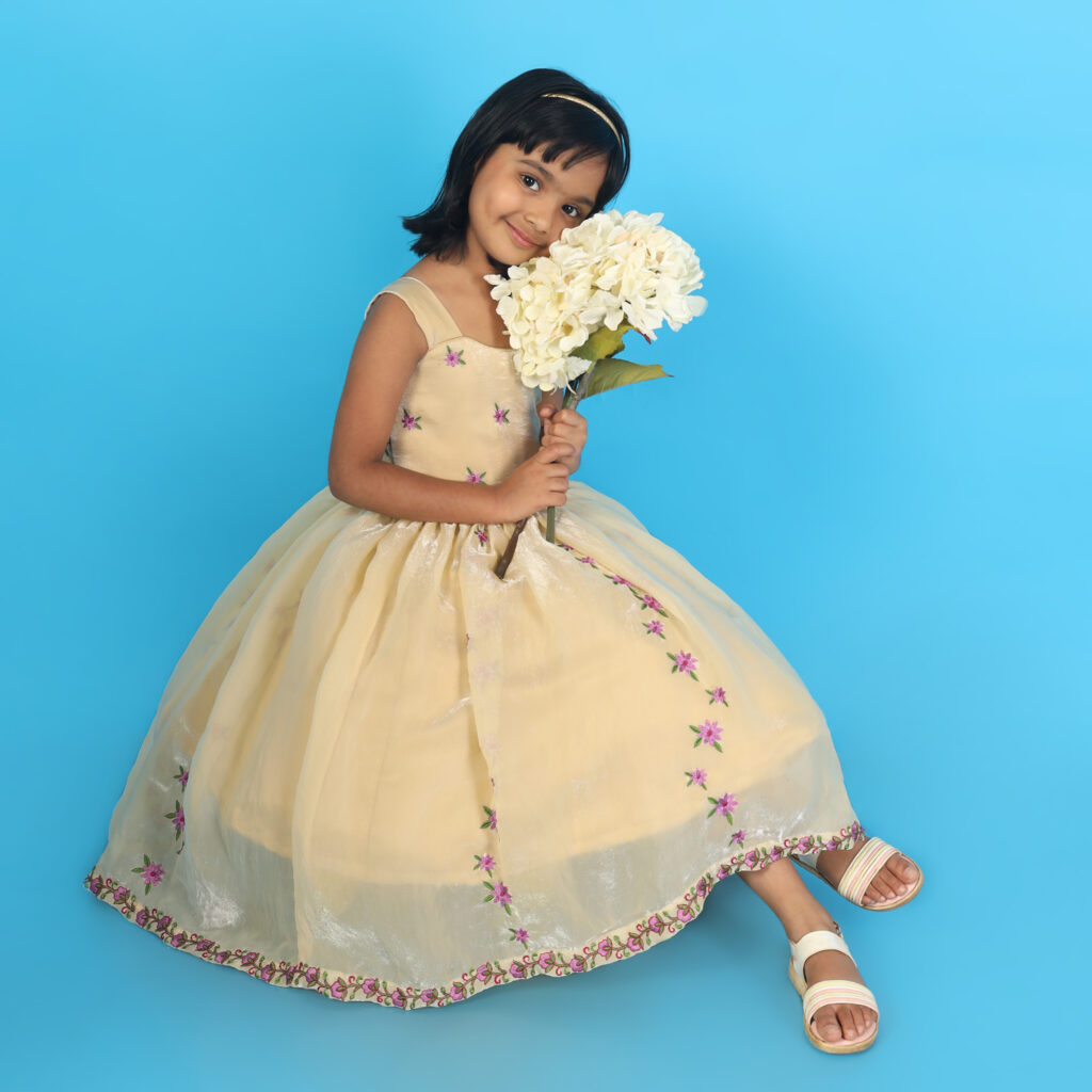 Closeup blossom flower embroidery kids frock luxury designer detail