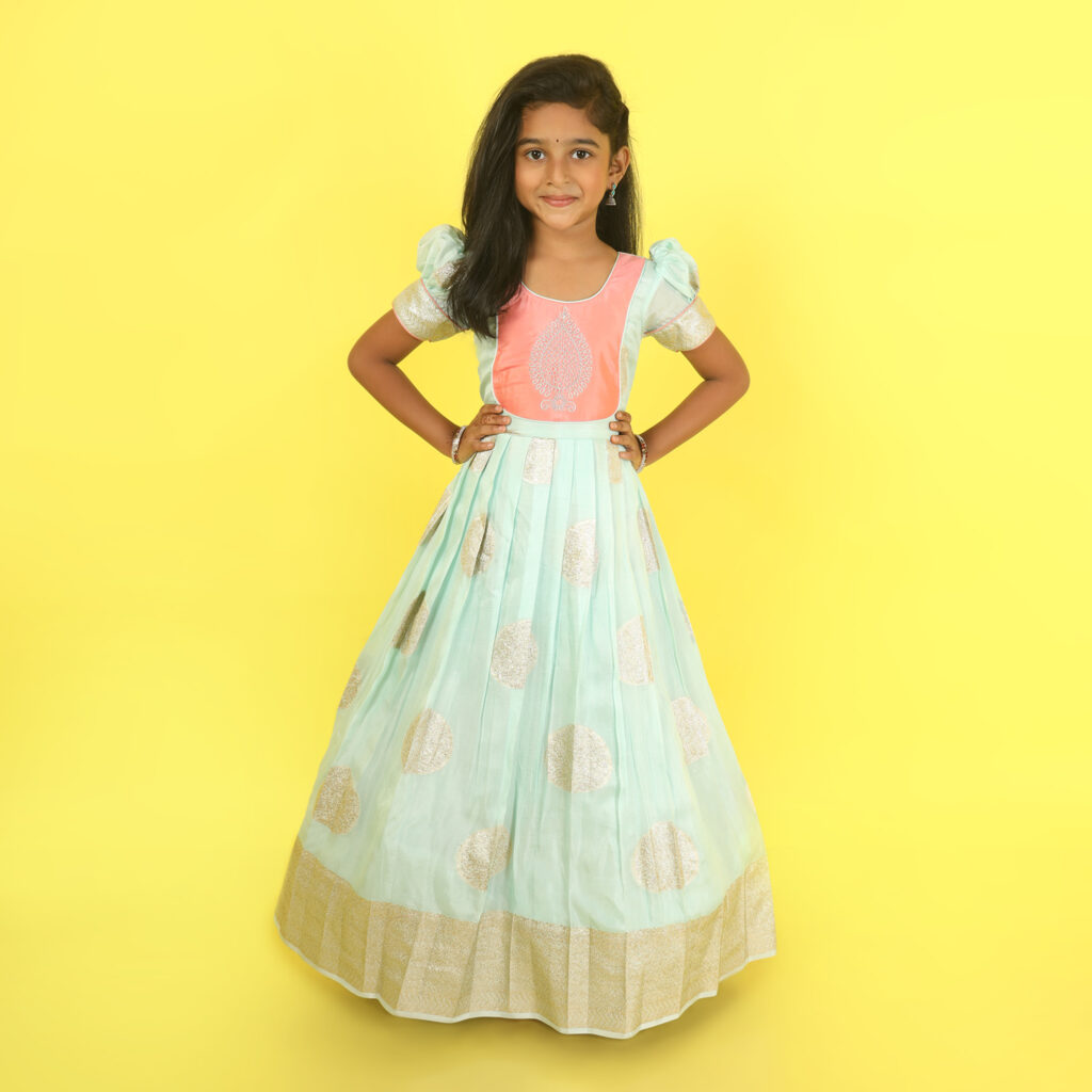 Yazh Nila customised sea green and peach long gown for girls