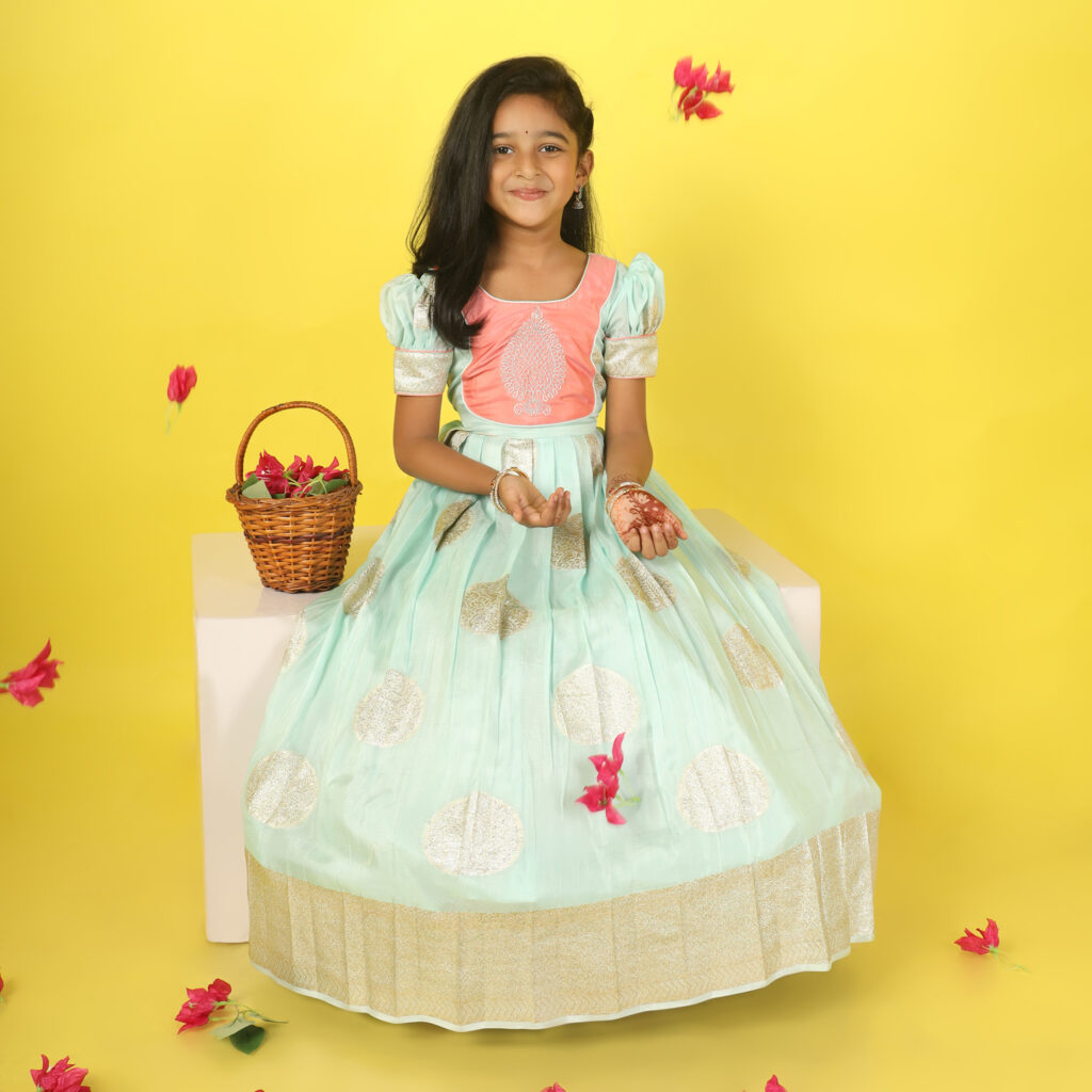 Side view sea green and peach girls long gown with puff sleeves