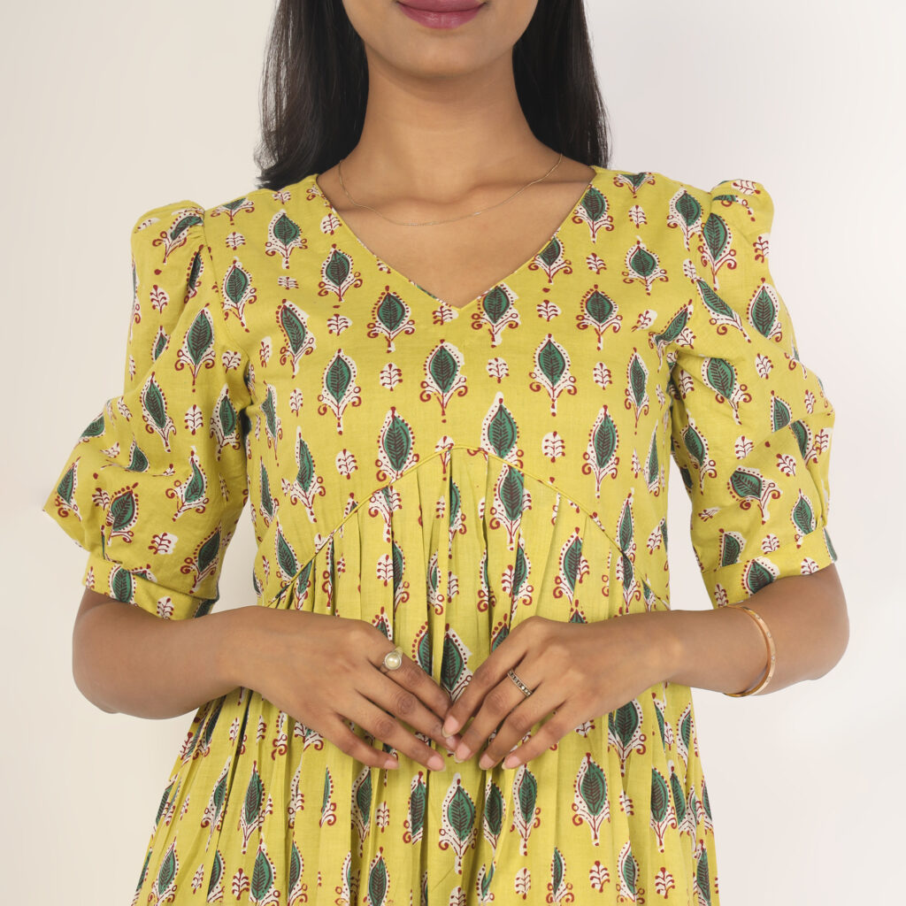 Mustard leafy print cotton dress fabric closeup breathable cotton