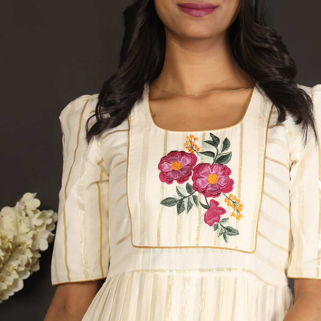 Ivory floral embroidered dress fabric embroidery closeup