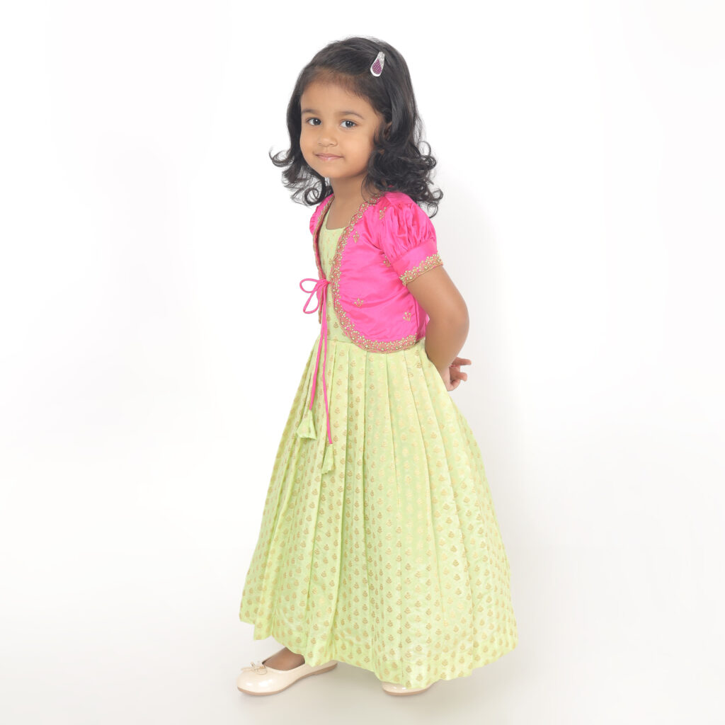 Full length girls ethnic dress in brocade silk with puff sleeves and embroidered jacket