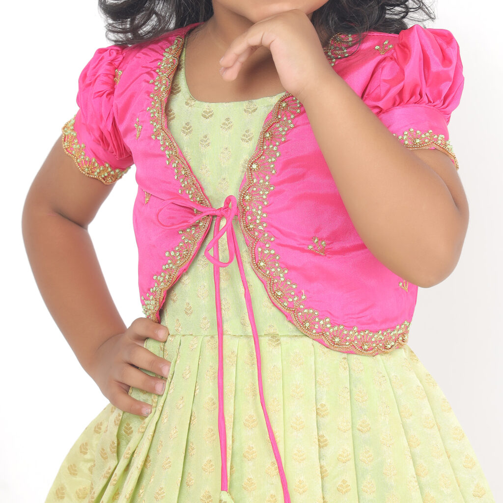 Close up of pink hand embroidered Aari work on girls ethnic dress jacket