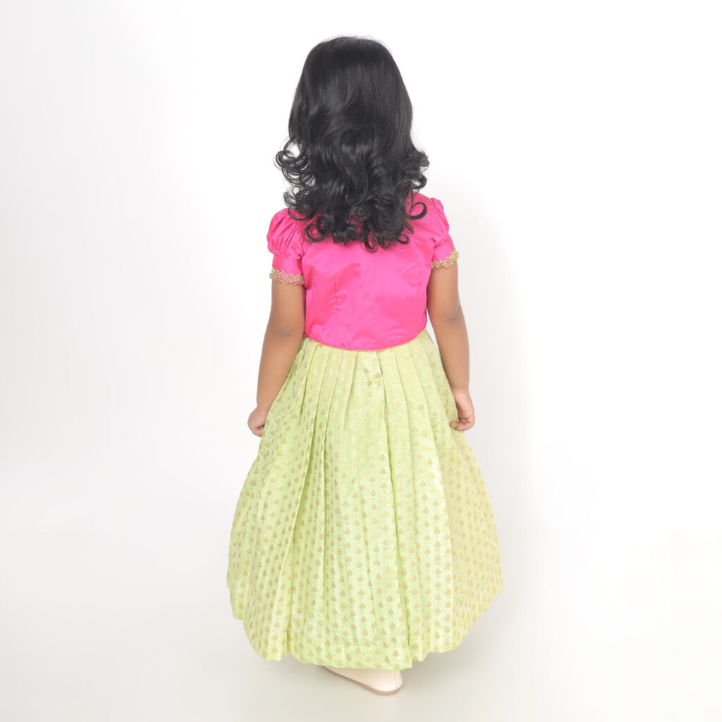 Back view of girls ethnic dress with puff sleeves and flowing silhouette