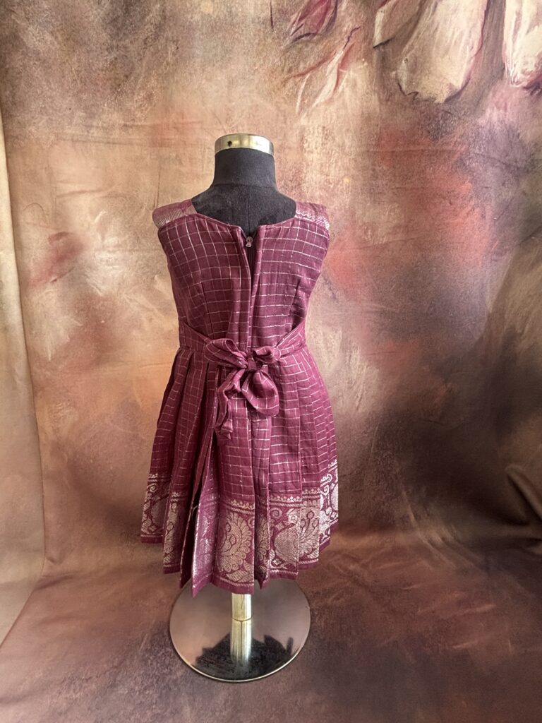 back view of purple traditional kids frock
