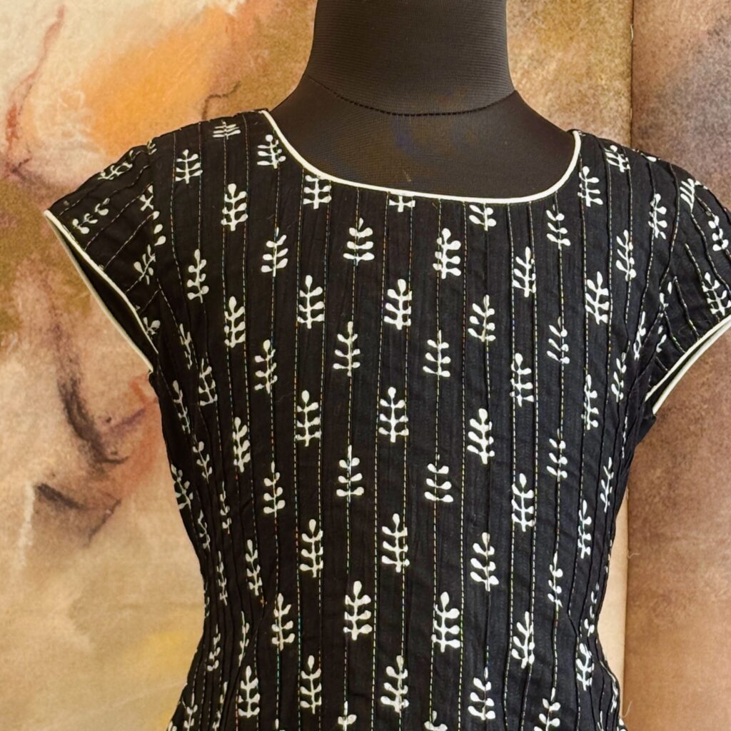 Front view of midnight black A-line cotton frock for girls