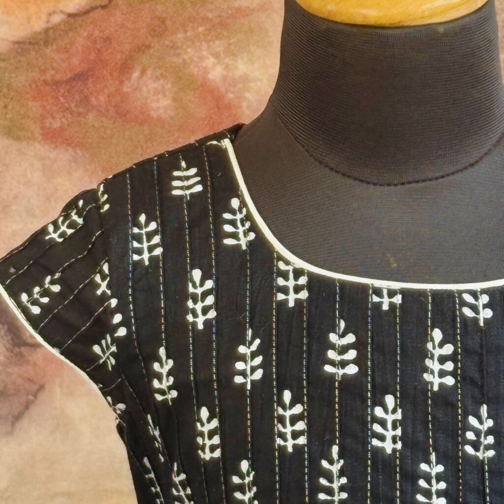 Close up detail of midnight black A-line cotton frock for girls