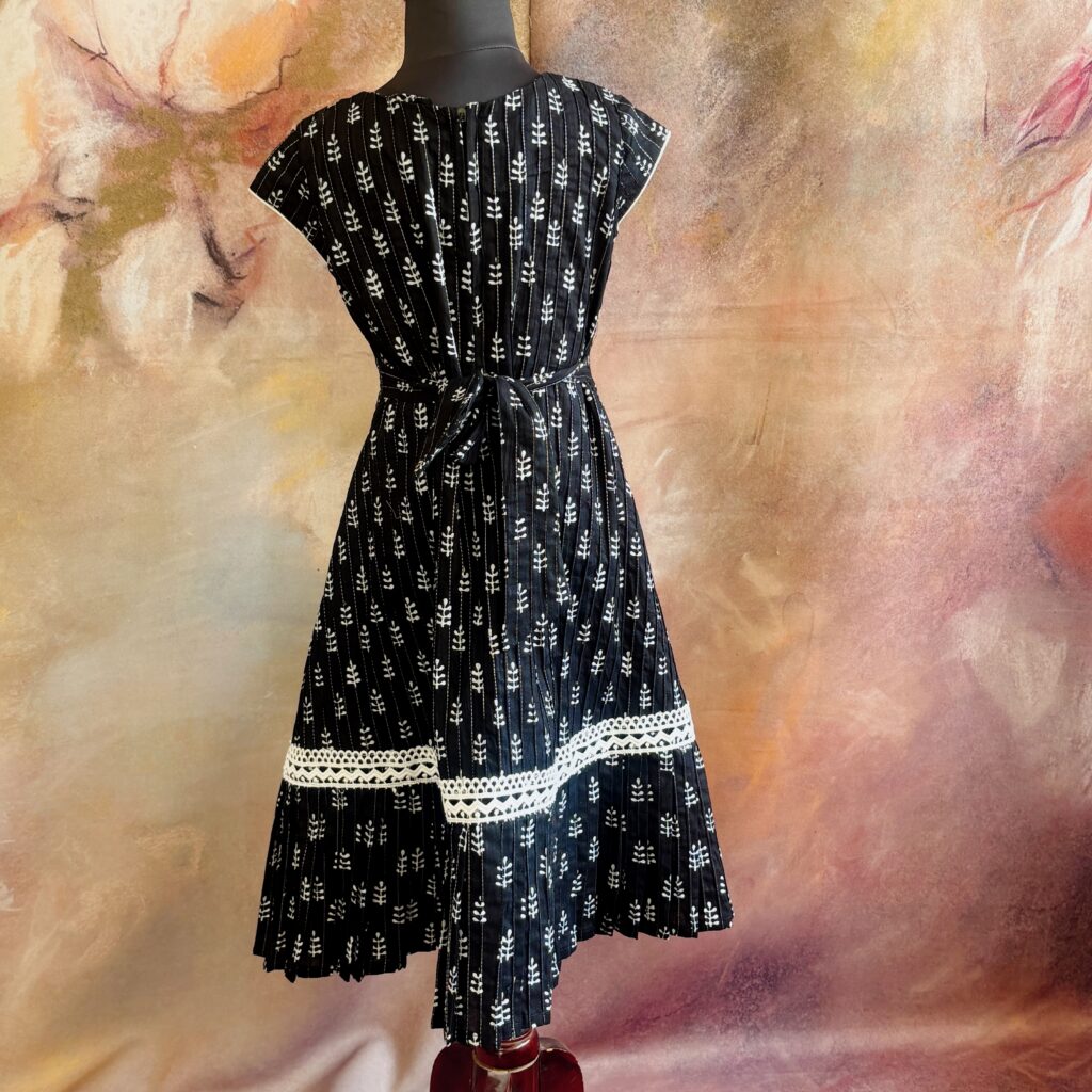 Back view of midnight black A-line cotton frock for girls