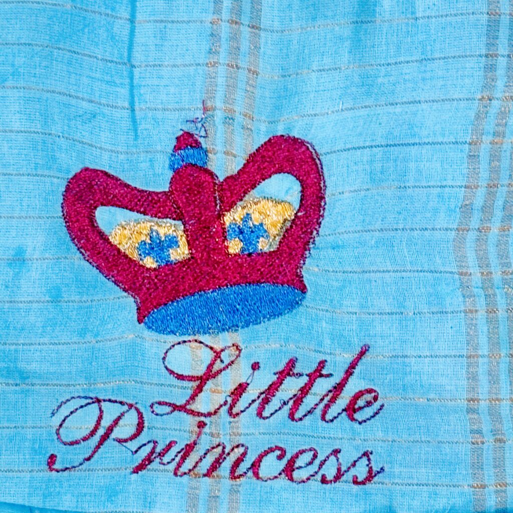 Embroidered bodice detail on sky blue Sungudi kids frock 1