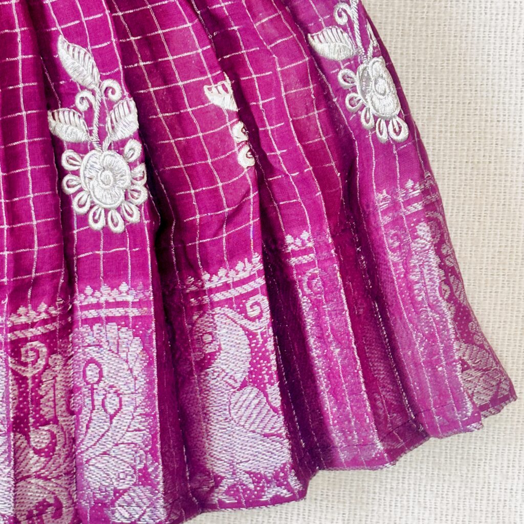 Border detail of plum kids festive frock