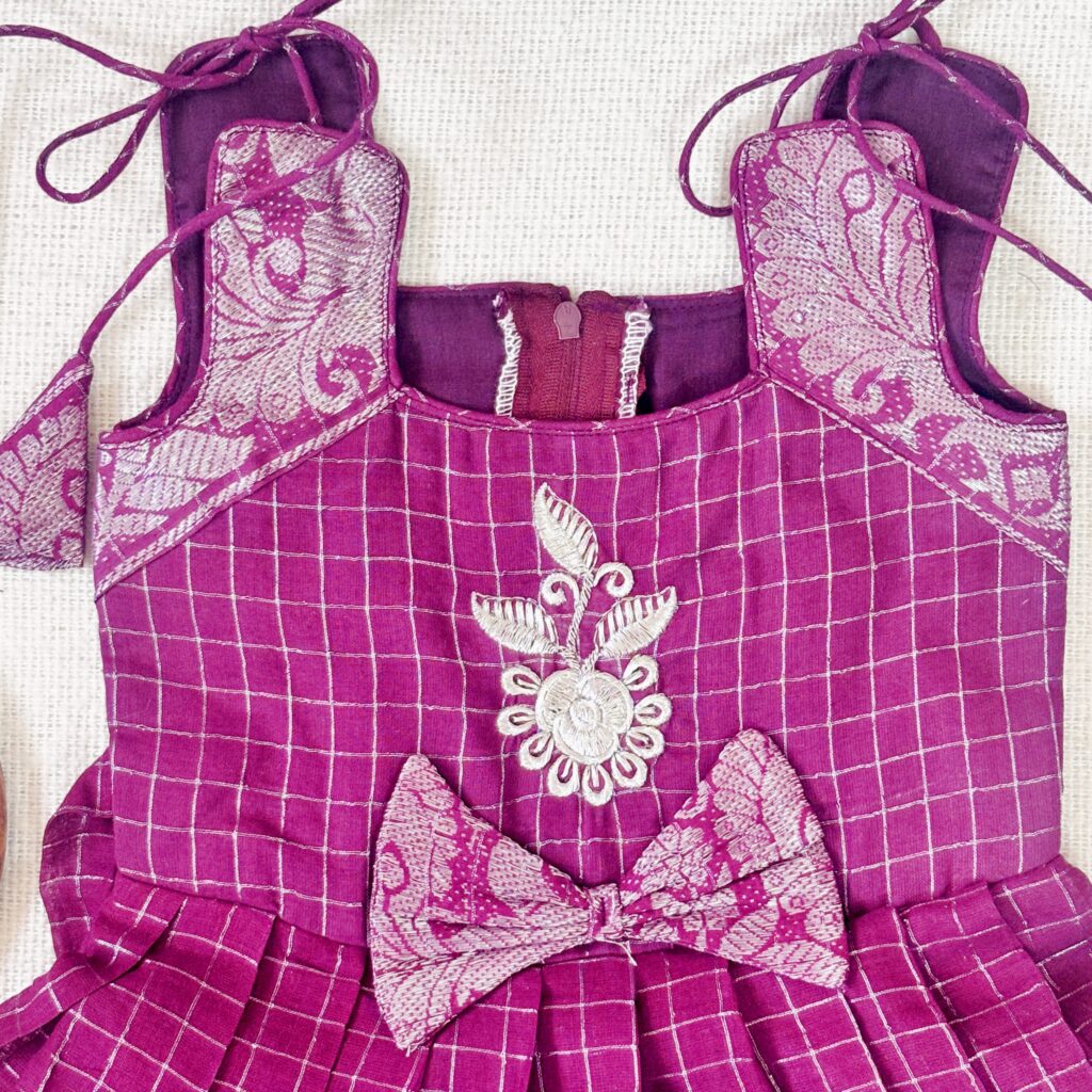 Floral embroidery detail on plum kids festive frock