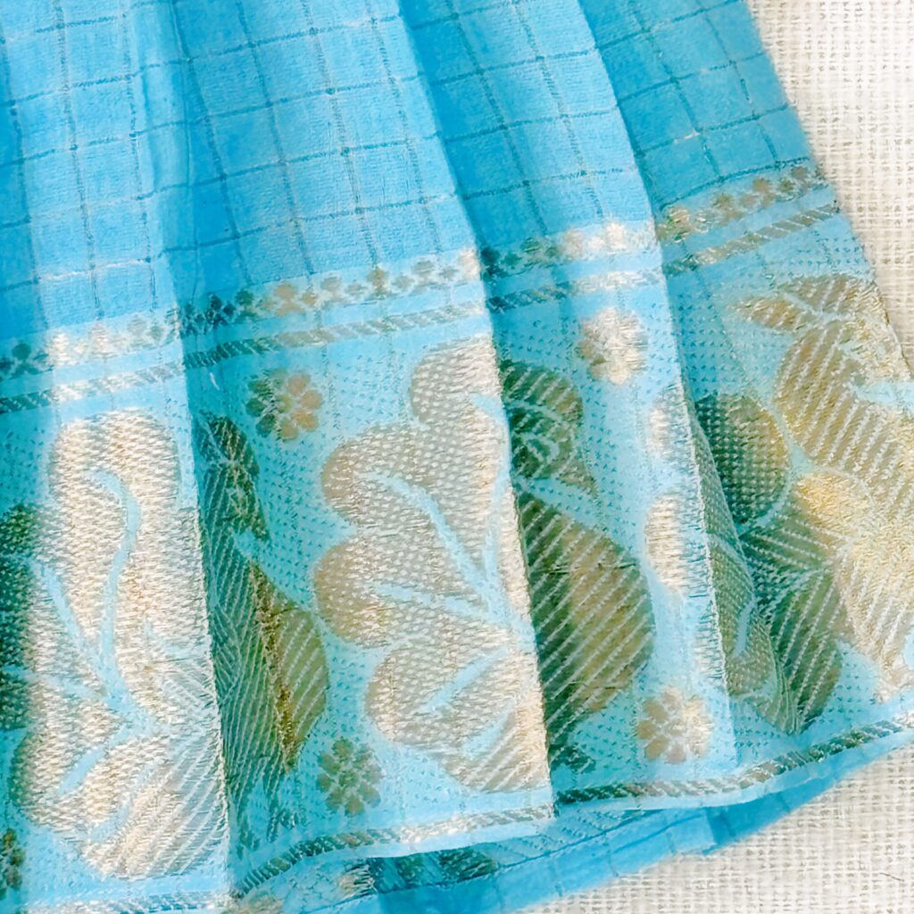 Sungudi print fabric and border detail of sky blue kids frock