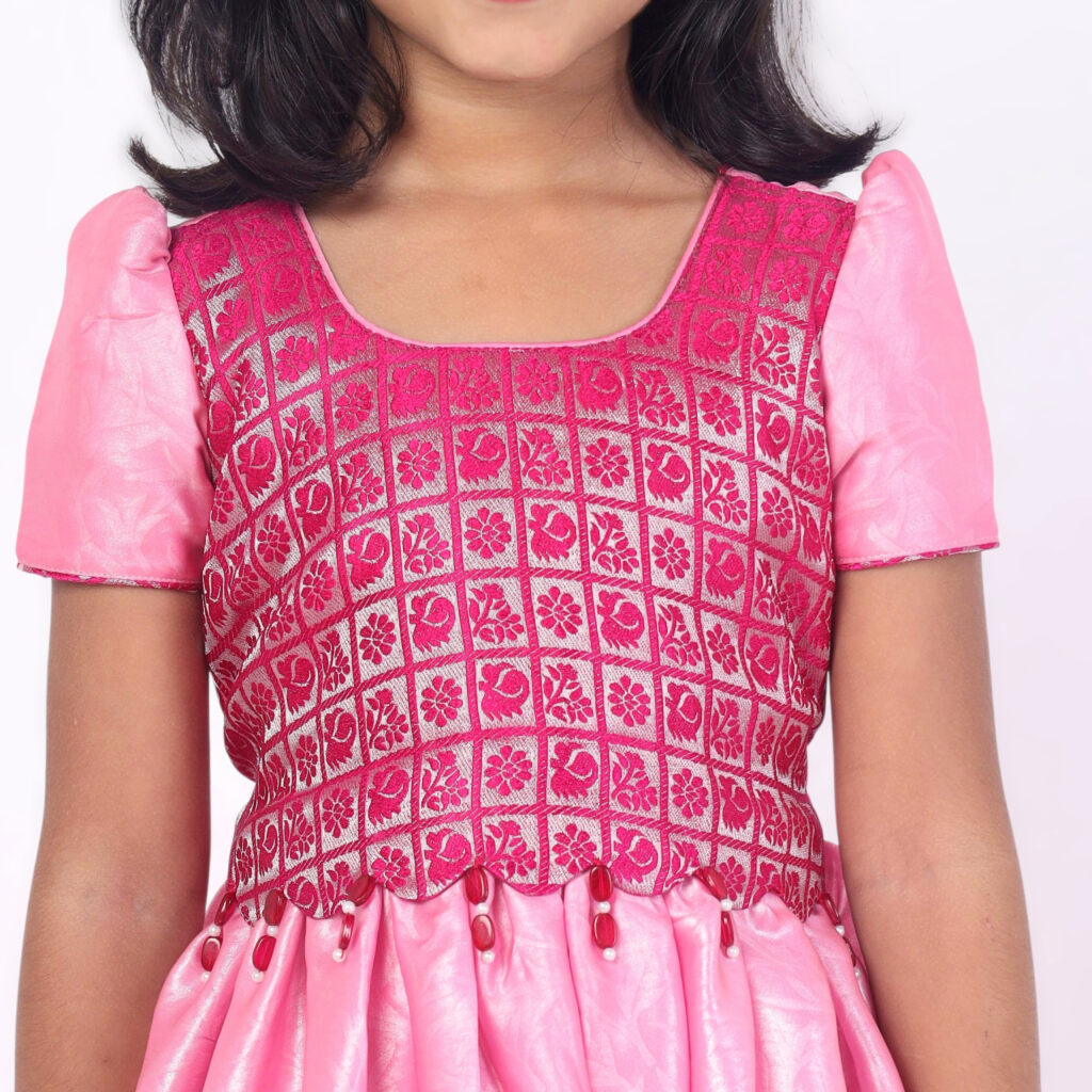Close up brocade printed silk bodice with scallop bead detailing on pink gown