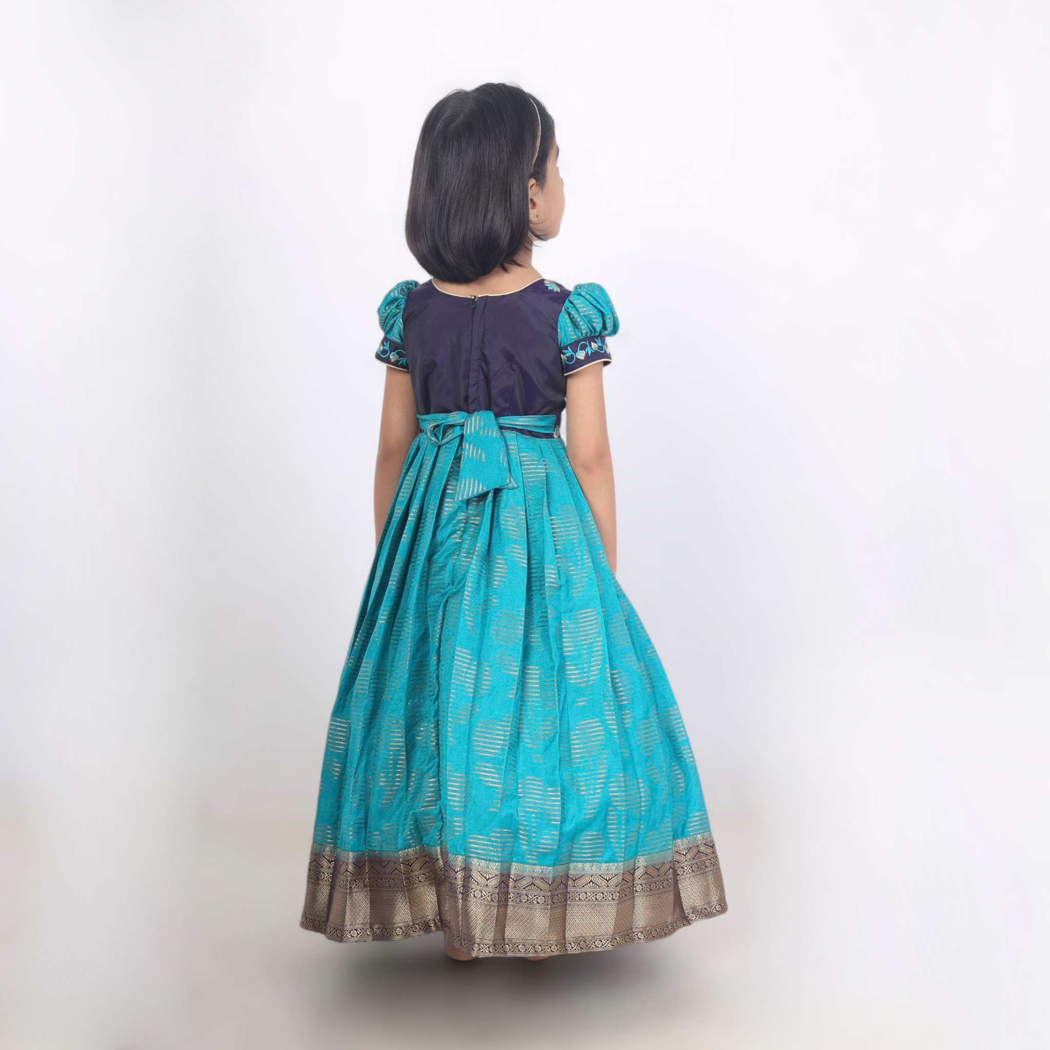 Varnika Neelika festive long gown back view traditional festive gown