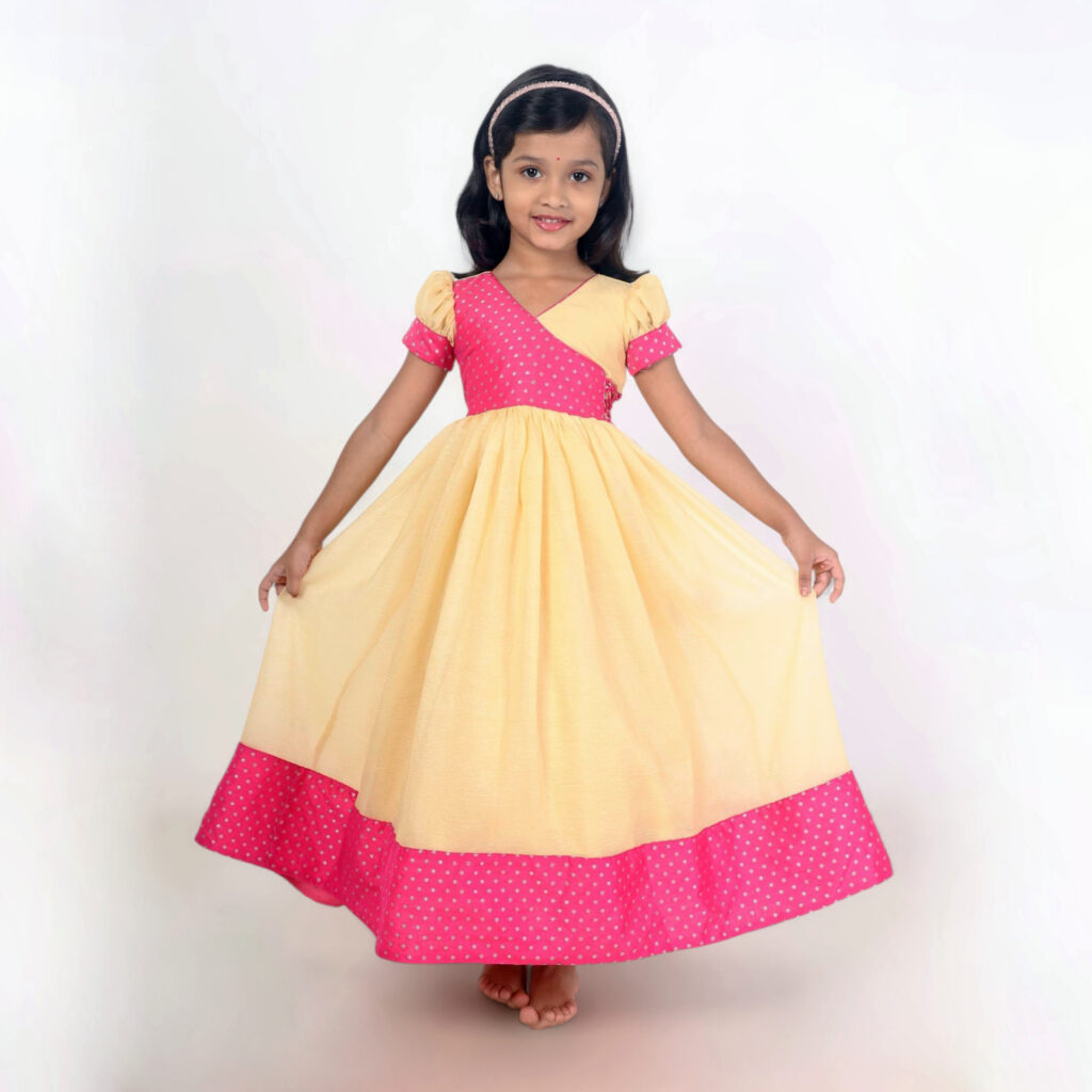 Girls pink long frock sunshine polka design front view