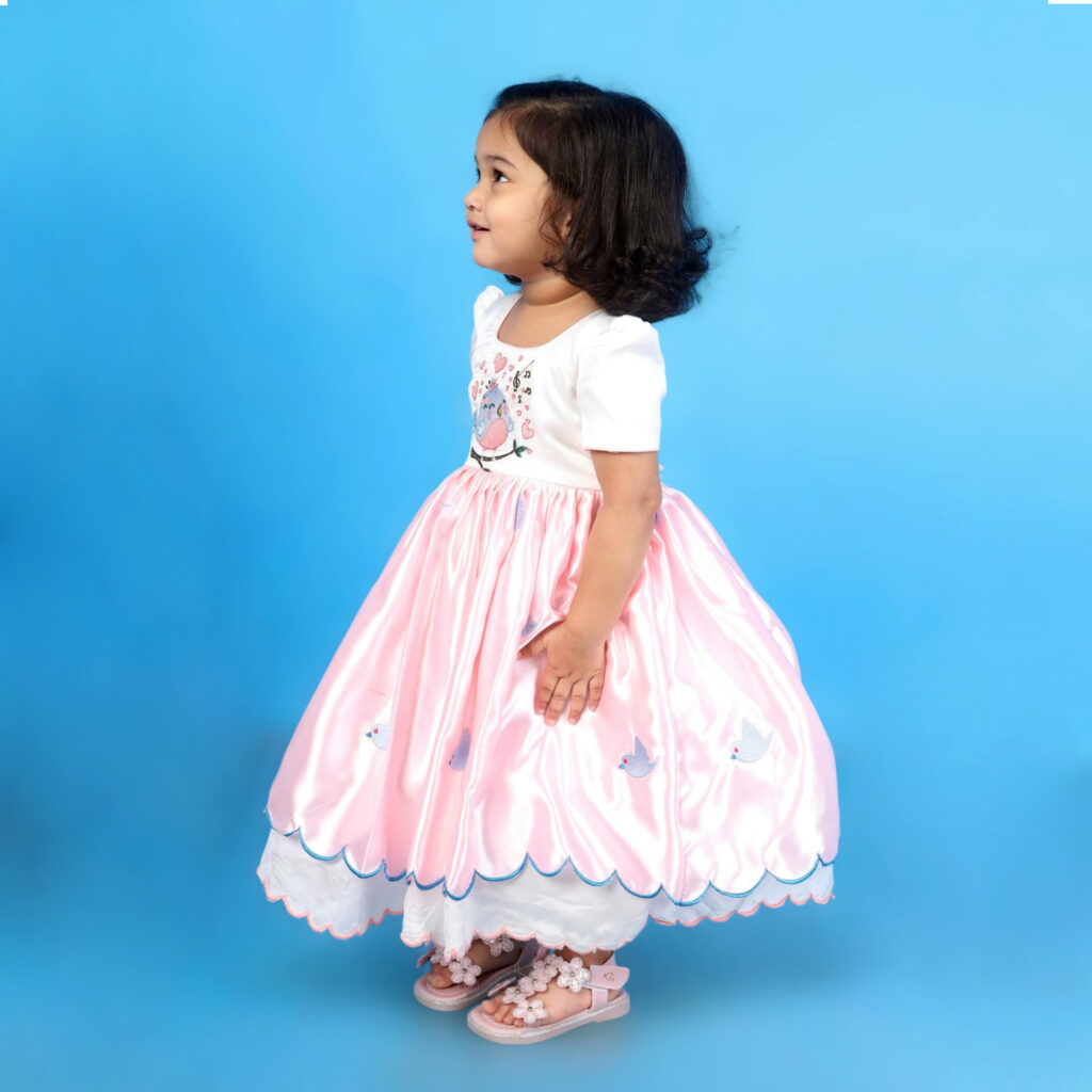 Side view of Aura organic satin kids frock with puff sleeves