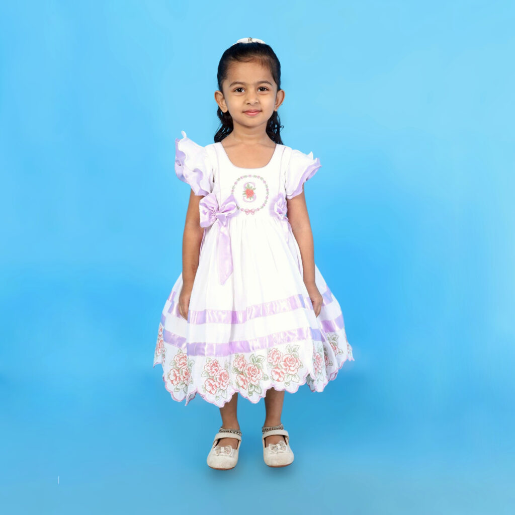 Front view of Mira organic cotton kids frock 1 with custom letter embroidery
