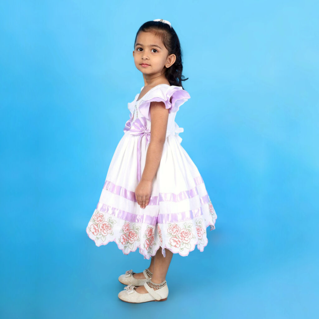 Side view of Mira organic cotton kids frock with butterfly sleeves