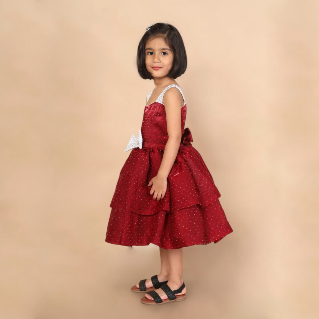 Cherry red layered frock side view Yazh Nila kids dress festive wear