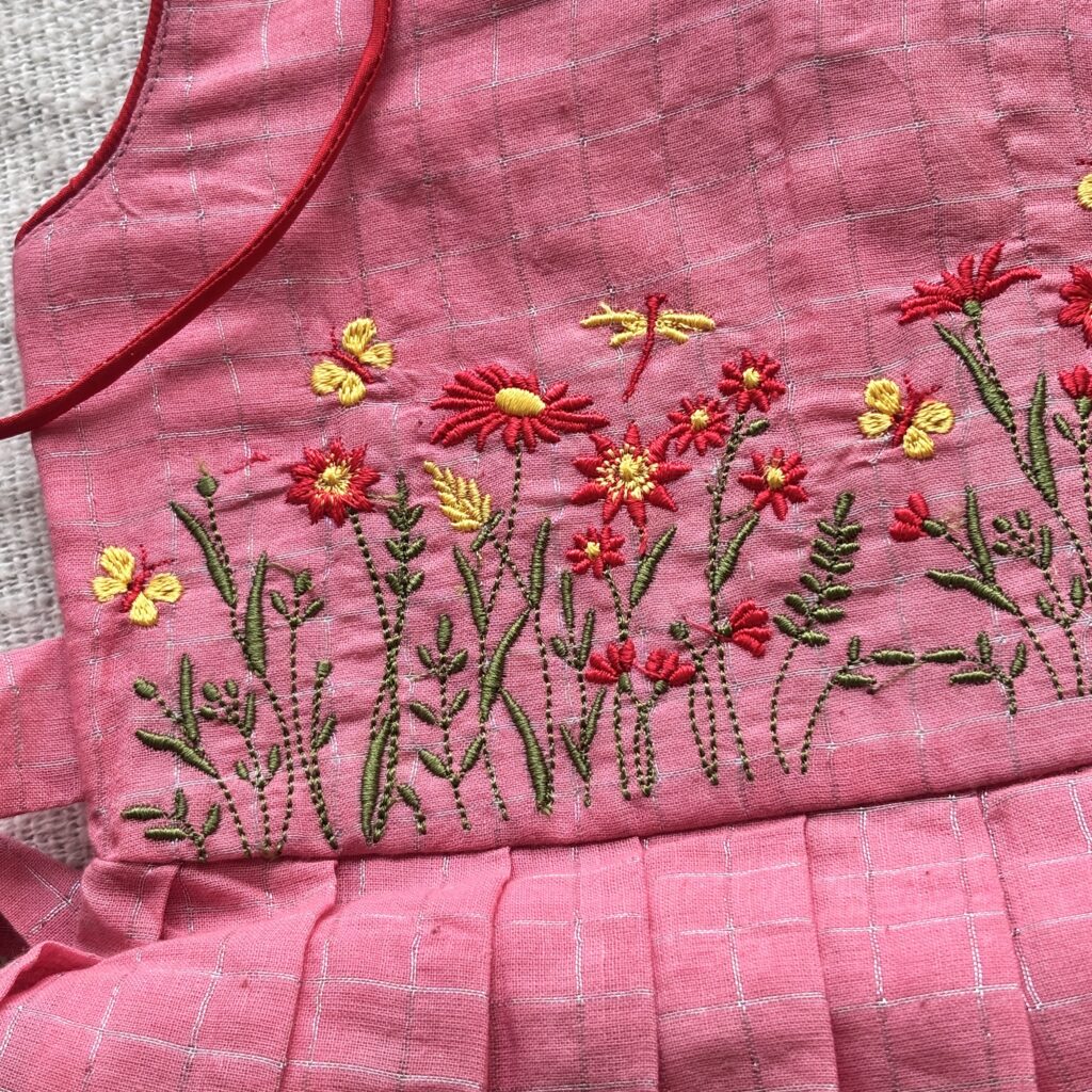 Top view of floral embroidered kids frock bodice detail