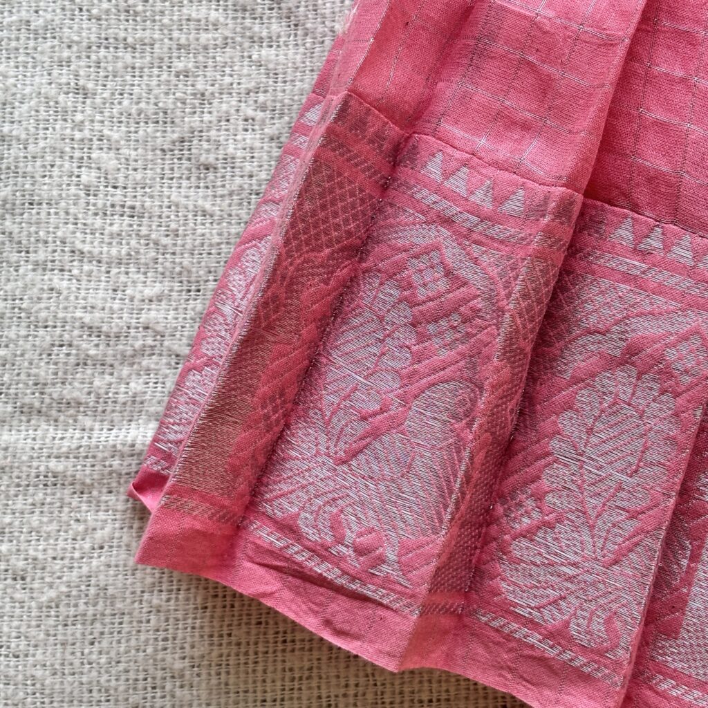 Border view of floral embroidered kids frock with one shoulder design