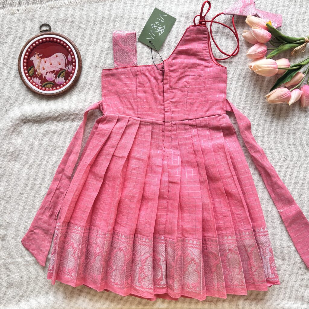 Back view of peacock embroidered kids frock with one shoulder design