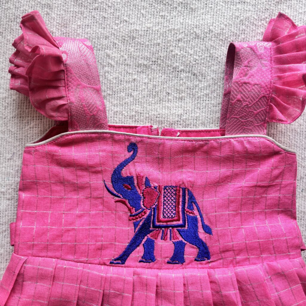 Pink kids festive frock shoulder detail