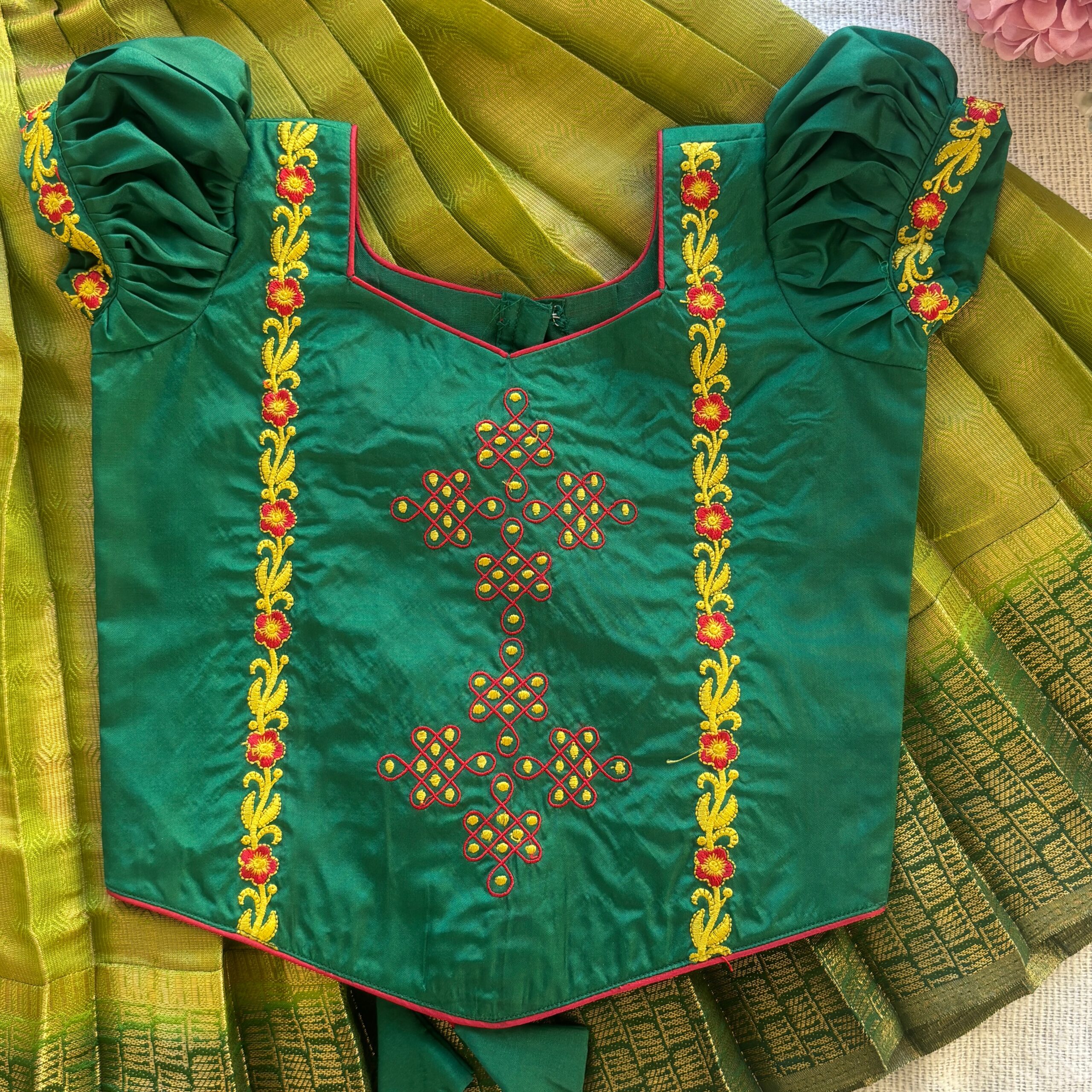 Front view of Taara green kolam skirt and crop top set for girls