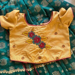 Front view of Taara teal skirt and beige embroidered crop top set for girls