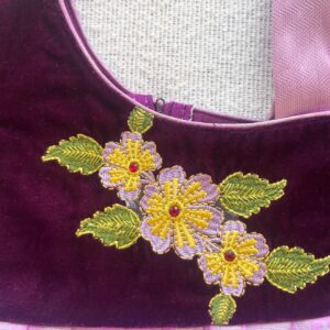 Close up detail of purple velvet long gown for girls