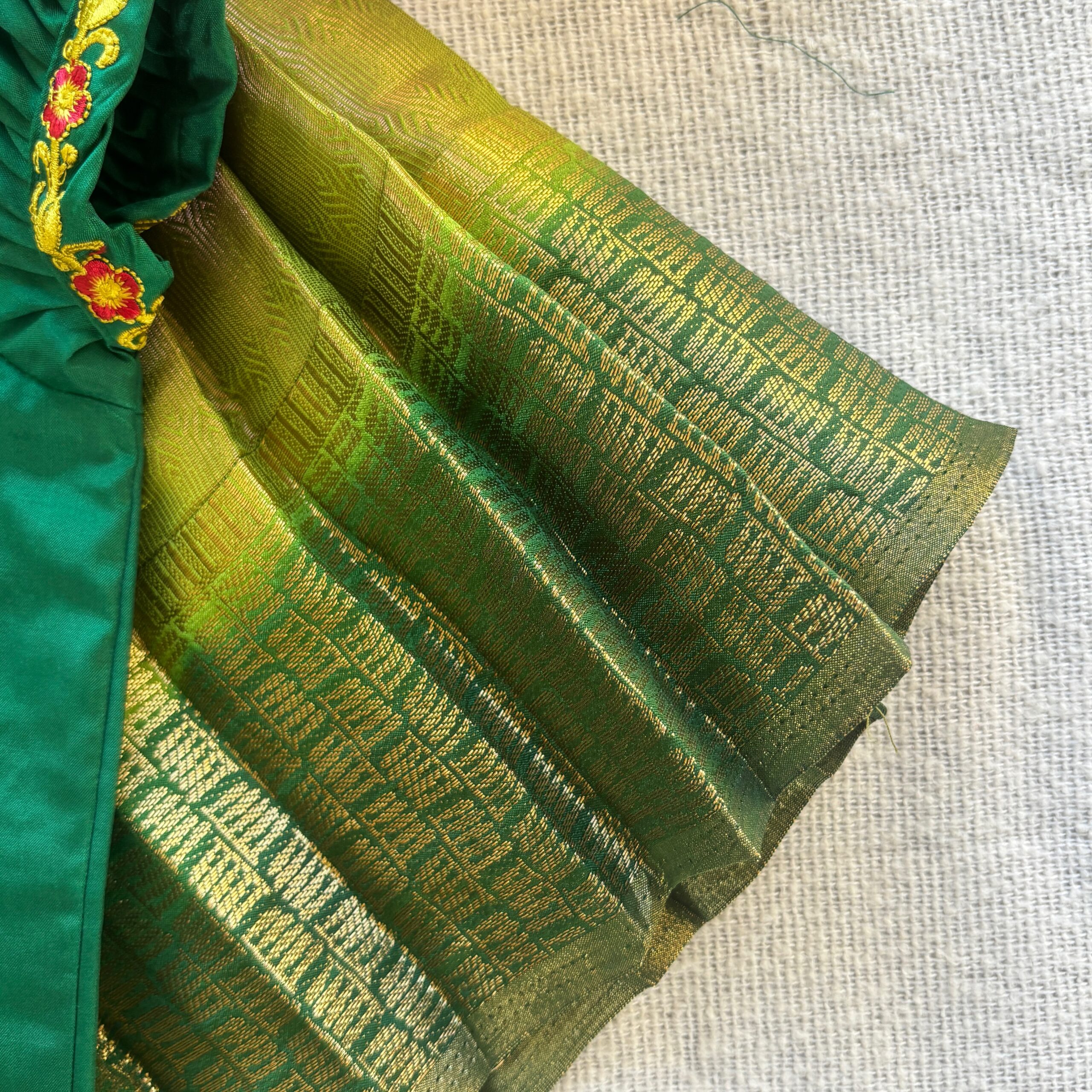 Side view of Taara green kolam skirt and crop top set for girls