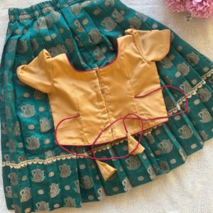 Back view of Taara teal skirt and beige embroidered crop top set for girls