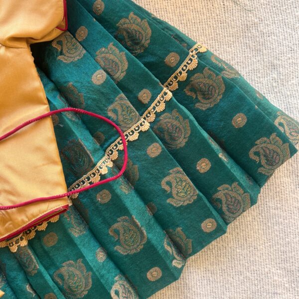 Side view of Taara teal skirt and beige embroidered crop top set for girls