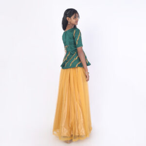 Back view of mustard girls skirt and peplum top set