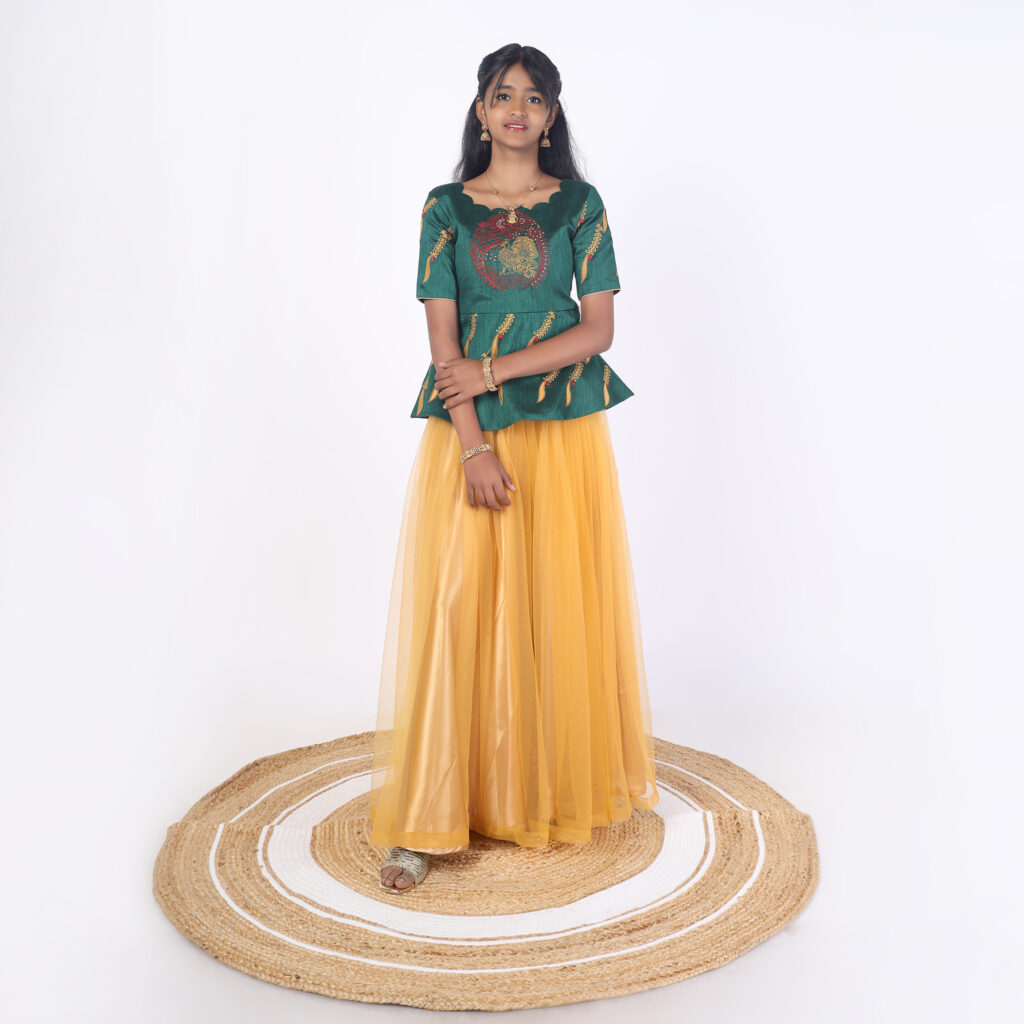 Mustard netted skirt and bottle green peplum top for girls front view