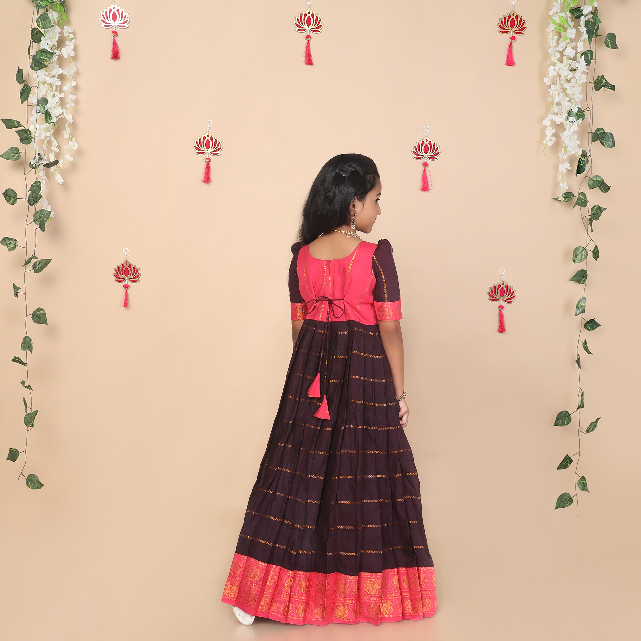 Back view of deep brown and pink ethnic long gown for girls